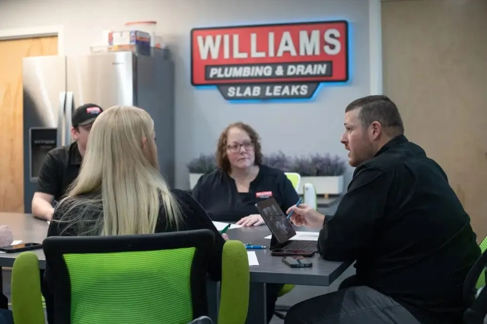 Williams Plumbing & Drain team and service trucks